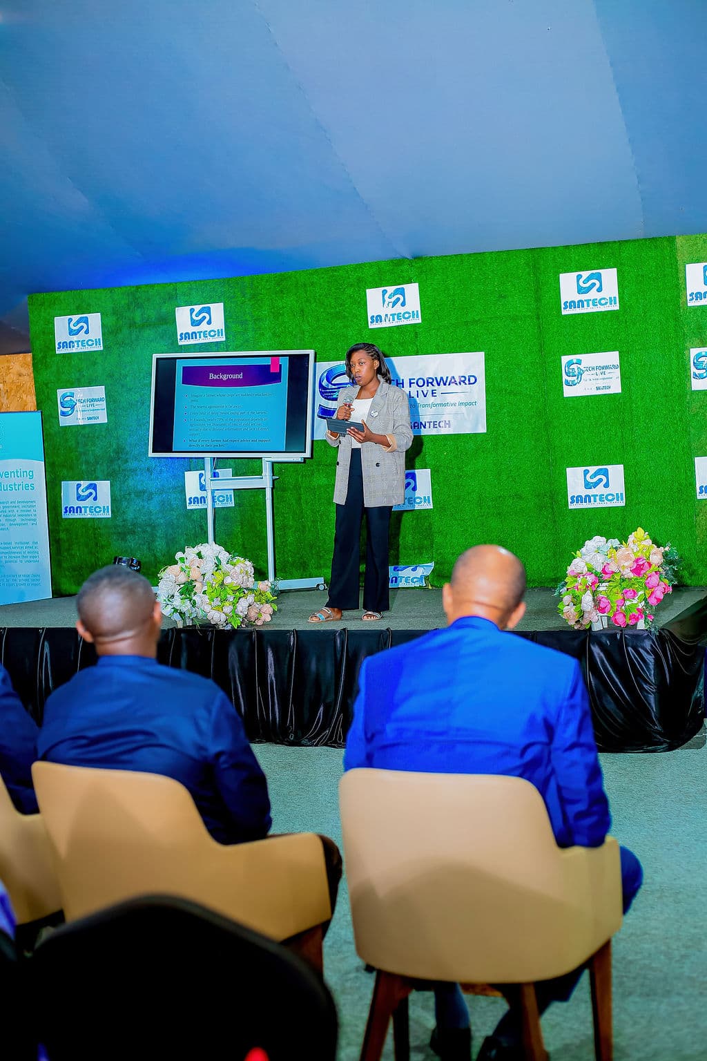 Innovator presenting digital solutions and AI systems on stage